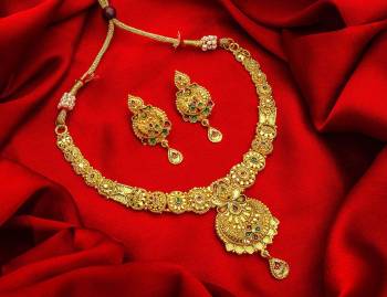 Give An Enhanced Look To Your Personality By Pairing Up This Beautiful Necklace Set With Your Ethnic Attire. This Pretty Set Is In Golden Color Beautified With Stone Work. Buy Now.