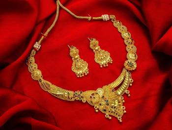 Give An Enhanced Look To Your Personality By Pairing Up This Beautiful Necklace Set With Your Ethnic Attire. This Pretty Set Is In Golden Color Beautified With Stone Work. Buy Now.