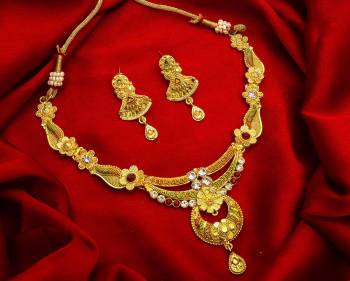 Give An Enhanced Look To Your Personality By Pairing Up This Beautiful Necklace Set With Your Ethnic Attire. This Pretty Set Is In Golden Color Beautified With Stone Work. Buy Now.