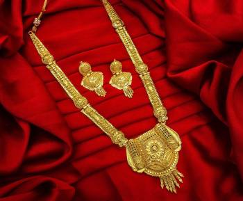 Give An Enhanced Look To Your Personality By Pairing Up This Beautiful Necklace Set With Your Ethnic Attire. This Pretty Set Is In Golden Color Beautified With Stone Work. Buy Now.