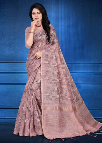 Here Is A Pretty Printed Saree For Your Semi-Casuals Or Festive Wear In Mauve Color. This Saree And Blouse Are Fabricated On Cotton Silk Beautified With Prints And Jari Checks. 