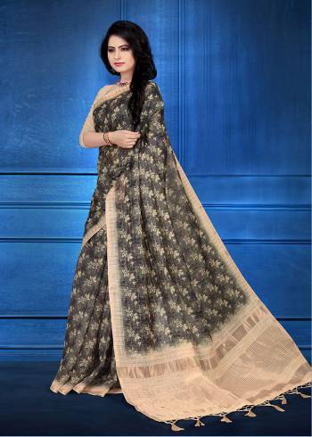 Here Is A Pretty Printed Saree For Your Semi-Casuals Or Festive Wear In Dark Grey Color. This Saree And Blouse Are Fabricated On Cotton Silk Beautified With Prints And Jari Checks. 