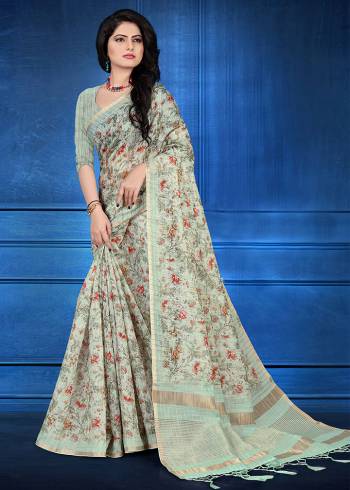 You Will Definitely Earn Lots Of Compliments Wearing This Designer Saree In Pastel Green Color. This Saree And Blouse Are Cotton Silk Based Beautified With Jari Checks And Prints. It Is Light In Weight And Easy To Carry All Day Long. 