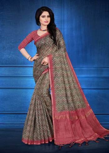 You Will Definitely Earn Lots Of Compliments Wearing This Designer Saree In Dark Grey Color. This Saree And Blouse Are Cotton Silk Based Beautified With Jari Checks And Prints. It Is Light In Weight And Easy To Carry All Day Long. 