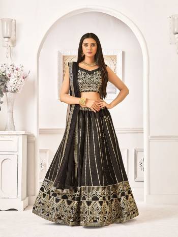 Adorn A Bold And Beautiful Look In This All Over Black Colored Designer Lehenga Choli. Its Blouse And Lehenga Are Fabricated On Satin Silk Paired With Net Fabricated Dupatta, Buy Now.