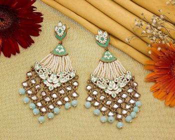 Grab This Pretty Heavy Earrings To Give An Enhanced Look To Your Ethnic Attire. It Is Beautified With Lovely Kundan And Pearl Work. Also It Is Light In Weight And Easy To Carry Throughout The Gala. Buy Now.