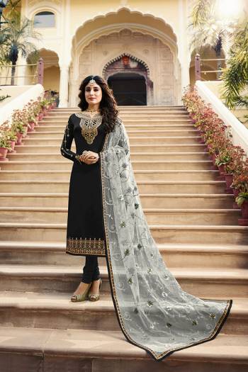 Grab This Very Beautiful Designer Straight Suit In Black Color Paired With Pretty Embroidered Grey Colored Dupatta. Its Top Is Fabricated On Satin Georgette Paired With Santoon Bottom and Net Fabricated Dupatta. Buy This Designer Embroidered Suit Now.