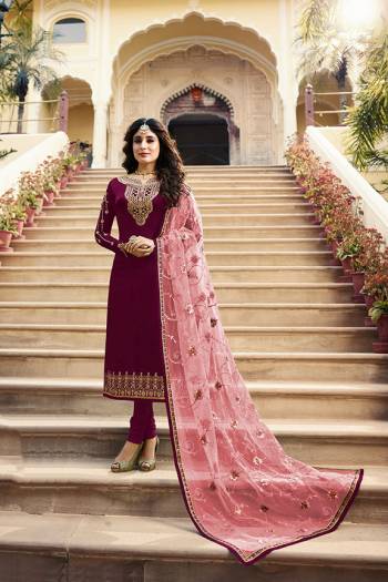 Grab This Very Beautiful Designer Straight Suit In Maroon Color Paired With Pretty Embroidered Peach Colored Dupatta. Its Top Is Fabricated On Satin Georgette Paired With Santoon Bottom and Net Fabricated Dupatta. Buy This Designer Embroidered Suit Now.