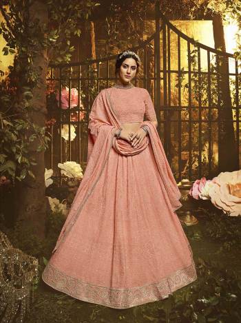 You Will Definitely Earn Lots Of Compliments Wearin This Pretty Looking Heavy Designer Lehenga Choli In Peach Color. This Lehenga, Choli And Dupatta Are Fabricated On Georgette Beautified With Tone To Tone Pretty Embroidery. 