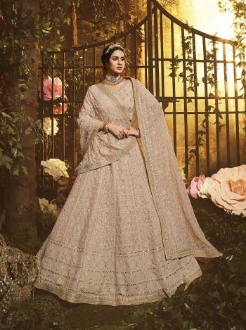 You Will Definitely Earn Lots Of Compliments Wearin This Pretty Looking Heavy Designer Lehenga Choli In Pastel Brown Color. This Lehenga, Choli And Dupatta Are Fabricated On Georgette Beautified With Tone To Tone Pretty Embroidery. 