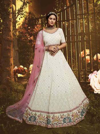 Grab This Very Beautiful Heavy Designer Lehenga Choli In White color Paired With Pink Colored Dupatta. This Pretty Heavy Embroidered Lehenga Choli Are Fabricated On Georgette Paired With Net Fabricated Dupatta. Buy This Pretty Piece Now.