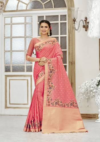 Add This Beautiful And Elegant Looking Saree To Your Wardrobe In Peach Color. This Pretty Floral Weaved Saree Is Fabricated On Banarasi Silk Paired With Art Silk Fabricated Blouse. 