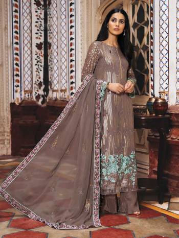 Grab This Heavy Designer Straight Suit In Brown Color. Its Top And Dupatta Are Fabricated On Georgette Paired With Santoon Bottom. It Is Beautified With Heavy Attractive Embroidery Over The Top. Buy Now.