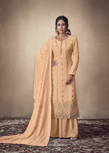 You Will Definitely Earn Lots Of Compliments Wearing This Designer Straight Suit In Light Orange Color. Its Weaved Top Is Fabricated Banarasi Jacquard Paired With Satin Fabricated Bottom And Georgette Fabricated Dupatta Which Is Beautified With Pretty Tone To Tone Lakhnavi Work. 