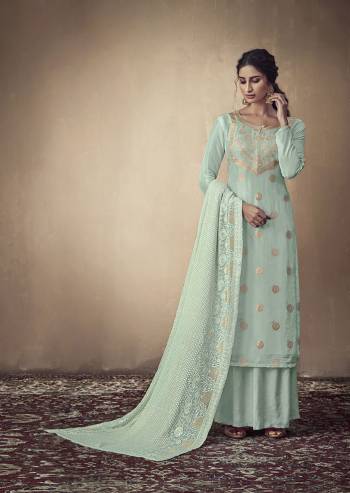 Here Is A Rich And Elegant Looking Designer Straight Suit In Sky Blue Color. Its Elegant Top Is Fabricated On Banarasi Jacquard Paired With Satin Bottom And Georgette Fabricated Lakhnavi Embroidered Dupatta. Its Subtle Tone To Tone Embroidery Gives Rich And Elegant Look To Your Personality. 