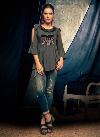 Here Is A Designer Readymade Top In Grey Color Fabricated On Rayon. This Pretty Top Is Beautified With Thread Work And Can Be Paired With Denim Or Pants. 