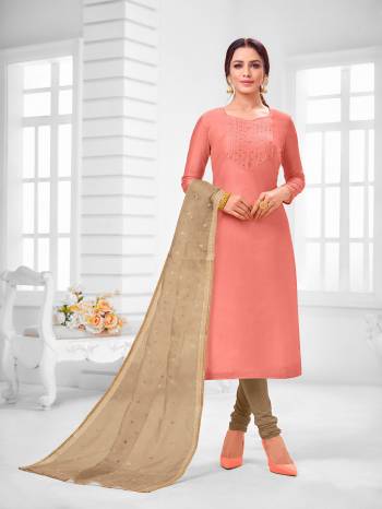 You Will Definitely Earn Lots Of Compliments Wearing This Designer Straight Suit In Peach Colored Top Paired With Beige Colored Bottom And Dupatta. Its Top Is Modal Silk Based Paired With Cotton Bottom and Orgenza Fabricated Dupatta. 