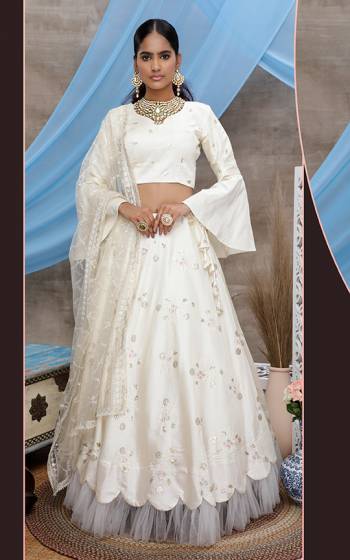 Grab This Designer Lehenga Choli For The Upcoming Wedding Season In White Color. Its Blouse And Lehenga Are Fabricated On Art Silk Paired With Net Fabricated Dupatta. 