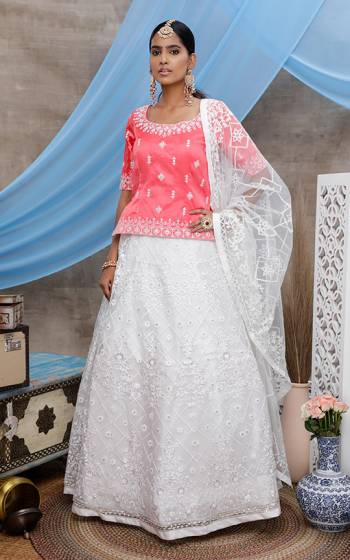 Grab This Designer Lehenga Choli For The Upcoming Wedding Season In Pink Colored Blouse Paired With White Colored Lehenga and Dupatta. Its Blouse Is Fabricated On Art Silk Paired With Net Fabricated Lehenga And Dupatta.