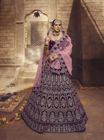 Get Ready For The Upcoming Wedding Season with This Heavy Designer Lehenga Choli In Magenta Pink Color Paired With Pink Colored Dupatta. This Heavy Embroidered Lehenga Choli Is Fabricated on Velvet Paired With Net Fabricated Dupatta. 