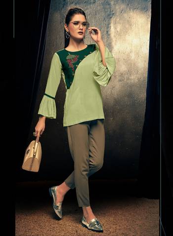 Here Is A Very Pretty Readymade Fancy Top In Green Color For Your College, Outing Or Work Place. This Top Is Fabricated On Rayon Beautified With Thread Work And Can Be Paired With Pants, Denim Or Skirt. 