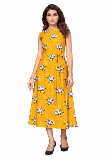 Here Is A Pretty Tunic Patterned Readymade Kurti In Yellow Color Fabricated On Crepe. This Pretty Kurti Is Beautified With Prints And Can Be Wore As A One Piece And Also Can Be Paired With Bottom. 