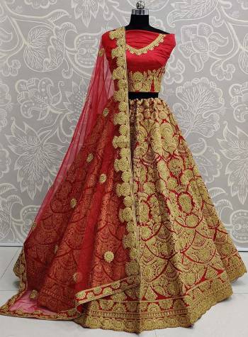 Here Is A Beautiful Heavy Embroidered Bridal Lehenga Choli In Red Color. Its Heavy Embroidered Blouse and Lehenga Are Fabricated On Art Silk Paired With Net Fabricated Dupatta. 