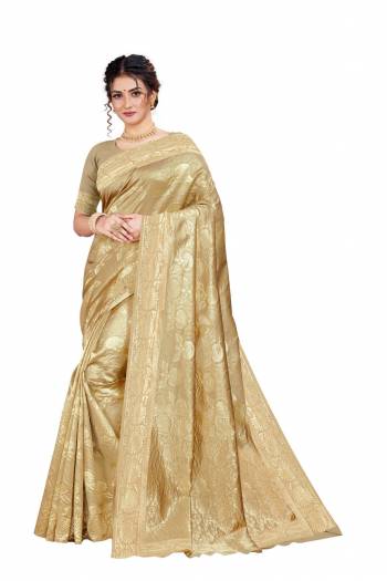 Celebrate This Festive Season With Beauty And Comfort Wearing This Designer Silk Based Saree In Cream Color. This Saree And Blouse Are Fabricated on Art Silk Beautified With Heavy Weave. 