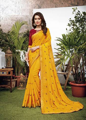 Celebrate This Festive Season With Beauty And Comfort Wearing This Designer Embroidered Saree In Yellow Color. This Saree Is Fabricated On Chiffon Paired With Art Silk Fabricated Blouse. 