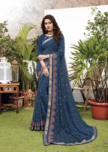 Look Pretty Wearing This Elegant Looking Designer Saree In Blue Color. This Pretty Saree Is Fabricated On Georgette Paired With Art Silk Fabricated Blouse. It Is Light In Weight And Easy To Carry All Day Long. 