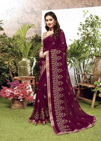 Celebrate This Festive Season With Beauty And Comfort Wearing This Designer Embroidered Saree In Wine Color. This Saree Is Fabricated On Chiffon Paired With Art Silk Fabricated Blouse. 