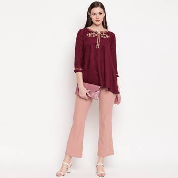 For your Semi Casual Wear, Grab This Simple Readymade Top In Maroon Fabricated On Rayon. This Top Is Best Suited With Denims And It Is Light In Weight And Easy To Carry All Day Long. 