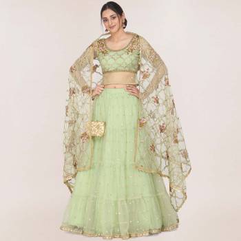 You will Definitely Earn Lots Of Compliments In This Trendy Heavy Designer Lehenga Choli In Pastel Green Fabricated On Net. Its Pretty Color Pallete And Grace Of Fabric Will Give An Elegant Look To Your Personality. 