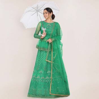 Add This Very Beautiful Heavy Designer Lehenga Choli To Your Wardrobe In Sea Green color. This Pretty Lehenga, Choli And Dupatta Are Net Based Beautified With Embroidery.