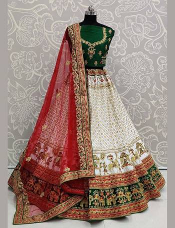 For A Proper Traditional Look, Grab This Heavy Designer Colorful Lehenga Choli In Green Colored Blouse Paired With White Colored Lehenga And Red Colored Dupatta. Its Heavy Embroidered Blouse And Lehenga Are Fabricated On Satin Paired With Net Fabricated Embroidered Dupatta. 