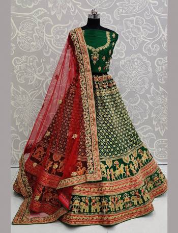 For A Proper Traditional Look, Grab This Heavy Designer Colorful Lehenga Choli In Green Colored Blouse Paired With Green Colored Lehenga And Red Colored Dupatta. Its Heavy Embroidered Blouse And Lehenga Are Fabricated On Satin Paired With Net Fabricated Embroidered Dupatta. 