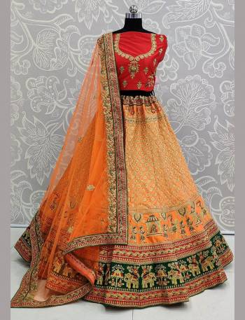 For A Proper Traditional Look, Grab This Heavy Designer Colorful Lehenga Choli In Red Colored Blouse Paired With Orange Colored Lehenga And Orange Colored Dupatta. Its Heavy Embroidered Blouse And Lehenga Are Fabricated On Satin Paired With Net Fabricated Embroidered Dupatta. 