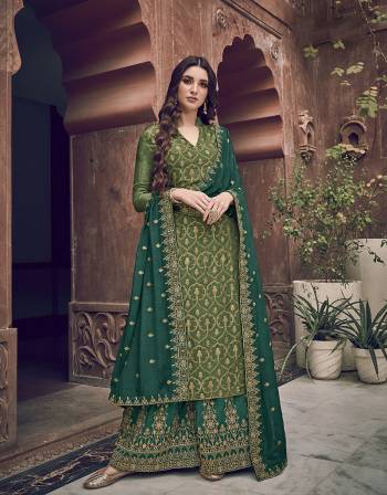 Go with The Lovely Shades Of Green Wearing This Designer Straight Suit In Green Colored Top Paired With Teal Green Colored Bottom and Dupatta. Its Top Is Fabricated On Jacquard Silk Paired With Art Silk Fabricated Bottom And Chiffon Fabricated Dupatta with Embroidery. 