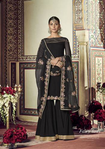 For A Bold And Beautiful Look, Grab This Elegant Looking Designer Sharara Suit In Black Color. Its Top And Bottom Are Georgette Based Paired With Net Fabricated Dupattta. Buy Now.