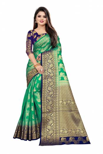 Celebrate This Festive Season In A Proper Traditonal Look Wearing This Silk Based Saree In Sea Green Color Paired With Royal Blue Colored Blouse. This Saree And Blouse Are Fabricated On Art Silk Beautified with Weave. 