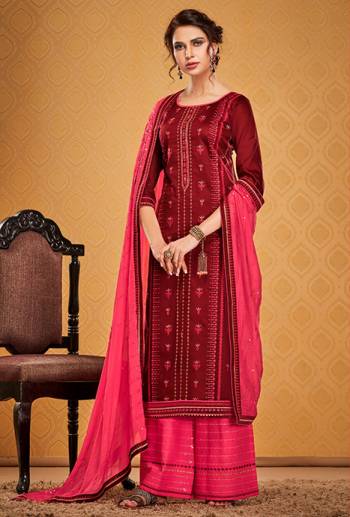 Get Ready For The Upcoming Wedding And Festive Season Wearing This Designer Straight Suit In Maroon Color Paired With Contrasting Dark Pink Colored bottom And Dupatta. Its Top Is Fabricated On Cotton Silk Paired With Rayon Silk bottom and Chinon Dupatta. Buy This Pretty Embroidered Suit Now.