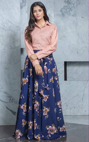 Look Pretty In This Trendy Pair Of Skirt And Top In Dusty Pink Colored Top Paired With Blue Colored Printed Skirt. Its Top Is Cotton Based Paired With Crepe Fabricated Skirt. Buy Now.