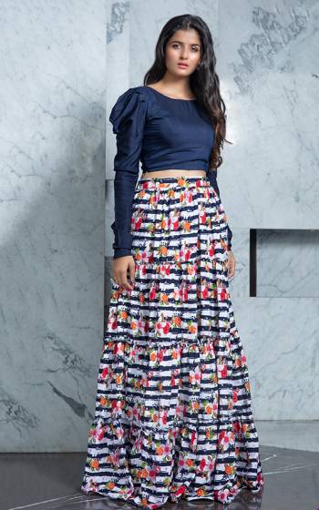 Look Pretty In This Trendy Pair Of Skirt And Top In Navy Blue Colored Top Paired With Multi Colored Printed Skirt. Its Top Is Rayon Based Paired With Crepe Fabricated Skirt. Buy Now.