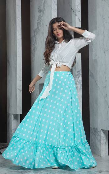 Look Pretty In This Trendy Pair Of Skirt And Top In White Colored Top Paired With Sky Blue Colored Printed Skirt. Its Top Is Rayon Based Paired With Crepe Fabricated Skirt. Buy Now.