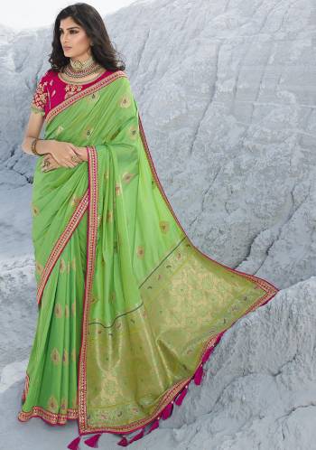 Here Is A Very Pretty Designer Saree In Lovely Parrot Green Color Paired With Contrasting Dark Pink Colored Blouse, This Saree Is Fabricated On Jacquard Silk Paired With Art Silk Fabricated Blouse. Its Rich Silk Fabric Gives A Royal Look To Your Personality. 