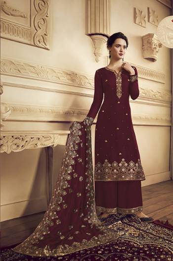 Flaunt Your Rich And Elegant Taste Wearing This Designer Straight Suit In Maroon Color.  This Pretty Embroidered Suit Is Fabricated On Crepe Which Is Light Weight, Soft Towards Skin And Easy To Carry All Day Long. 