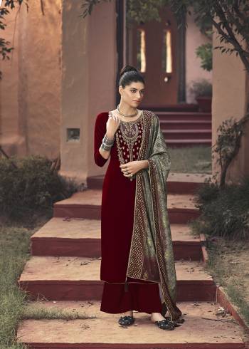 Look Attractive Wearing This New Pattenered Designer Straight Suit In Maroon Color Paired With Grey Colored Dupatta. Its Top Is Fabricated On Velvet Paired With Santoon Bottom And Chinon Dupatta. Its Top Is Beautified With Neck Embroidery And Dupatta Has Pretty Badhani Prints. 