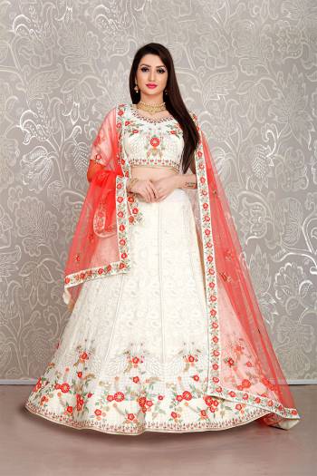 Flaunt Your Rich And Elegant Taste Wearing This Pretty White Colored Lehenga Choli Paired With Red Colored Dupatta. Its Blouse And Lehenga Are Fabricated On Georgette Paired With Net Fabricated Dupatta. 