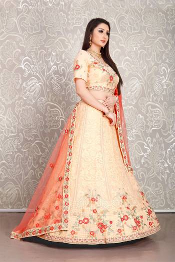 Flaunt Your Rich And Elegant Taste Wearing This Pretty Peach Colored Lehenga Choli Paired With Orange Colored Dupatta. Its Blouse And Lehenga Are Fabricated On Georgette Paired With Net Fabricated Dupatta. 