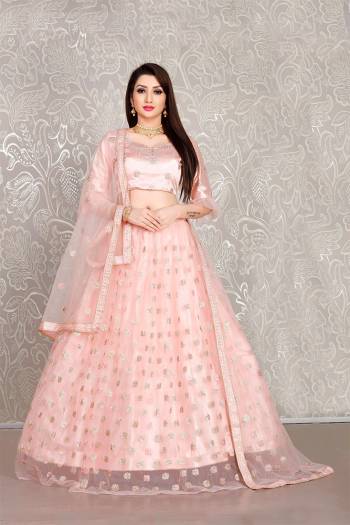 Simple And Elegant Looking Designer Lehenga Choli Is Here In All Over Baby Pink Color. This Lehenga Choli IS Net Based Beautified With Pretty Attractive Embroidered Buttis. 